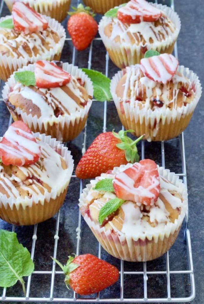 Strawberry muffins on a cooling rack.