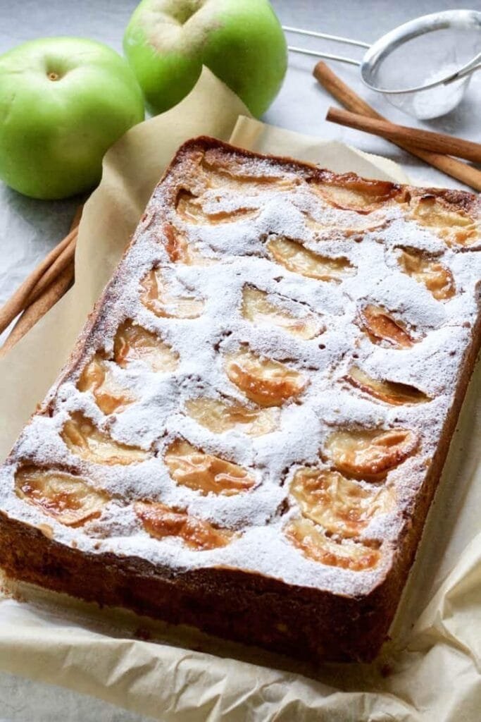 Dorset apple cake with icing sugar out of the tin.