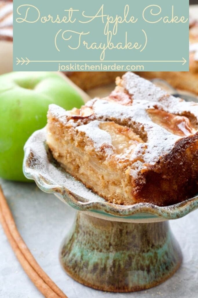 Slice of Dorset apple cake on a mini stand.