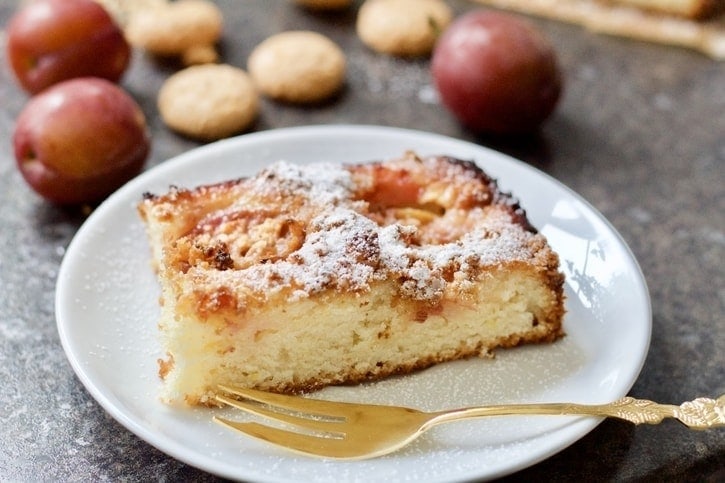 Close up of the piece of cake on a plate with a fork.