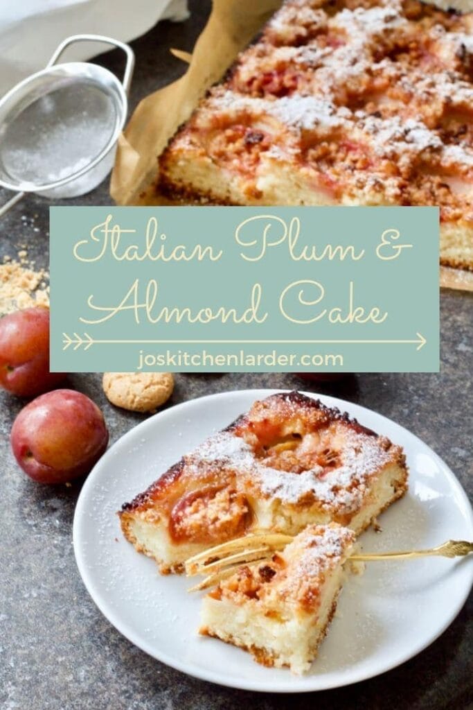 Serving of plum and almond cake on a plate with a fork.