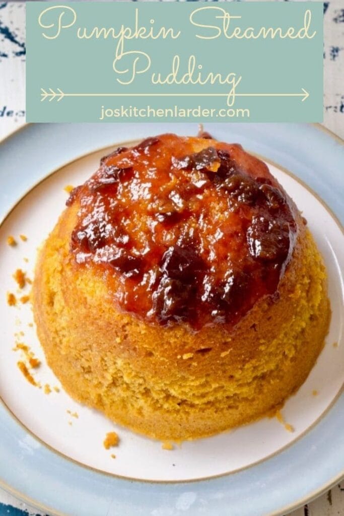 Whole pumpkin steamed sponge pudding on a plate.