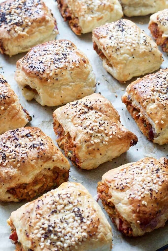 Veggie sausage rolls on a baking paper.