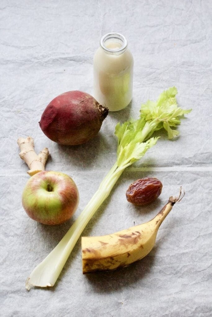 Beetroot, apple, celery, date, ginger, banana & bottle of oat milk.