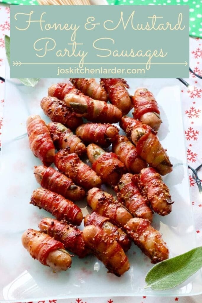 Cocktail sausages wrapped in bacon on a platter.