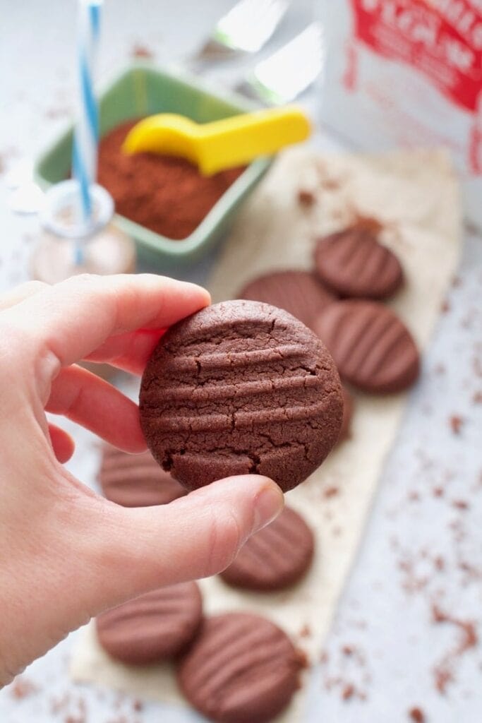 Hand holding a biscuit.