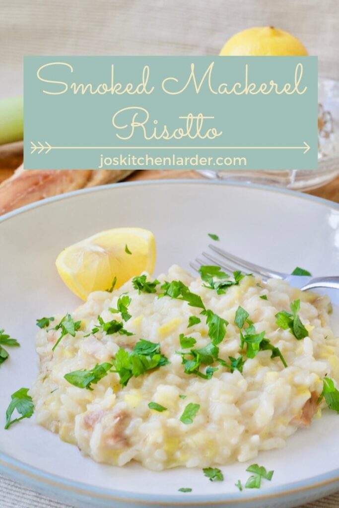 Portion of risotto in a bowl with lemon wedge.