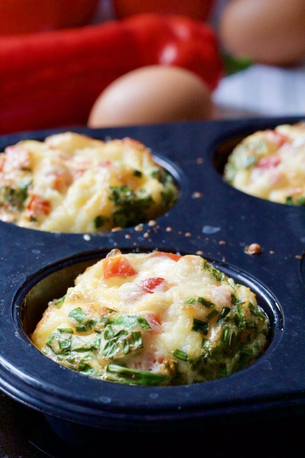 Close up of an egg muffin in a muffin tin.