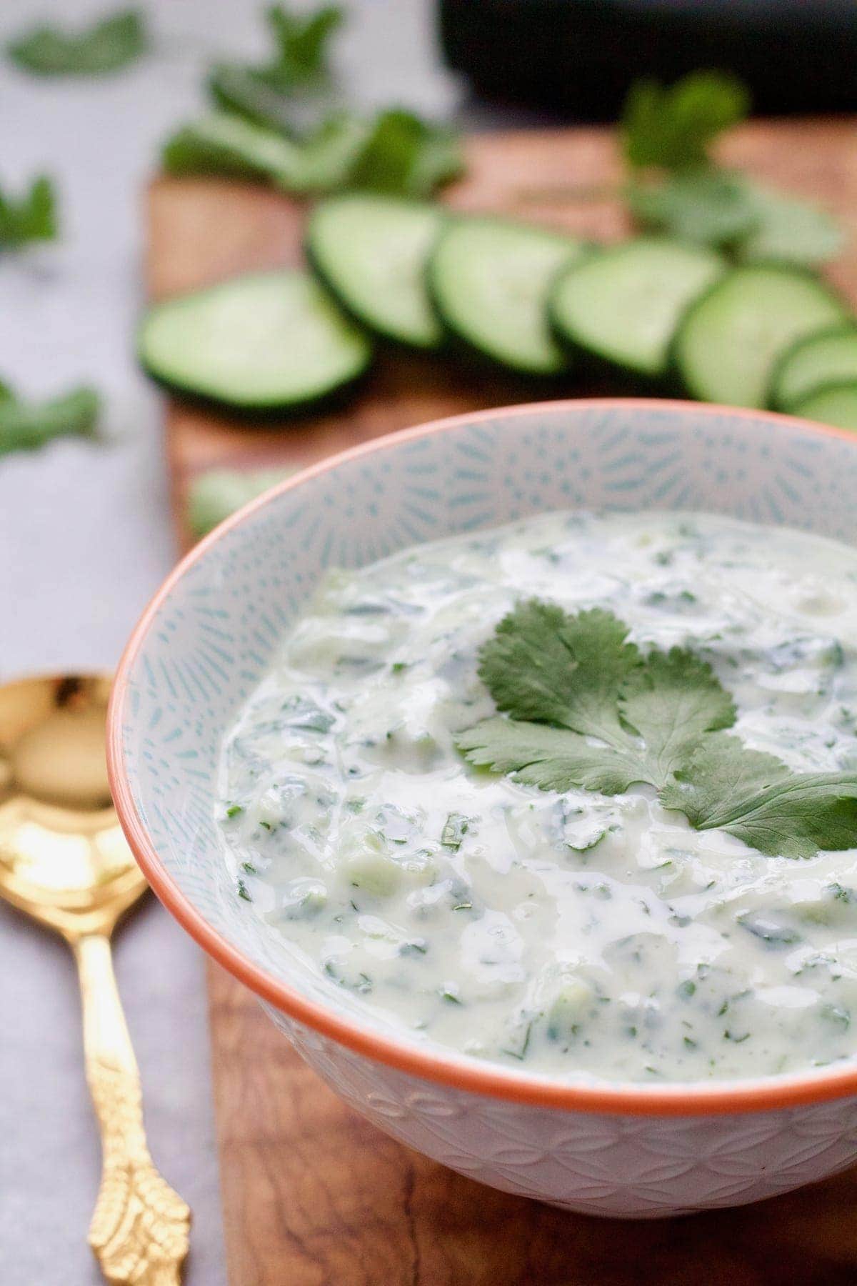 Close up of raita sauce in a bowl.