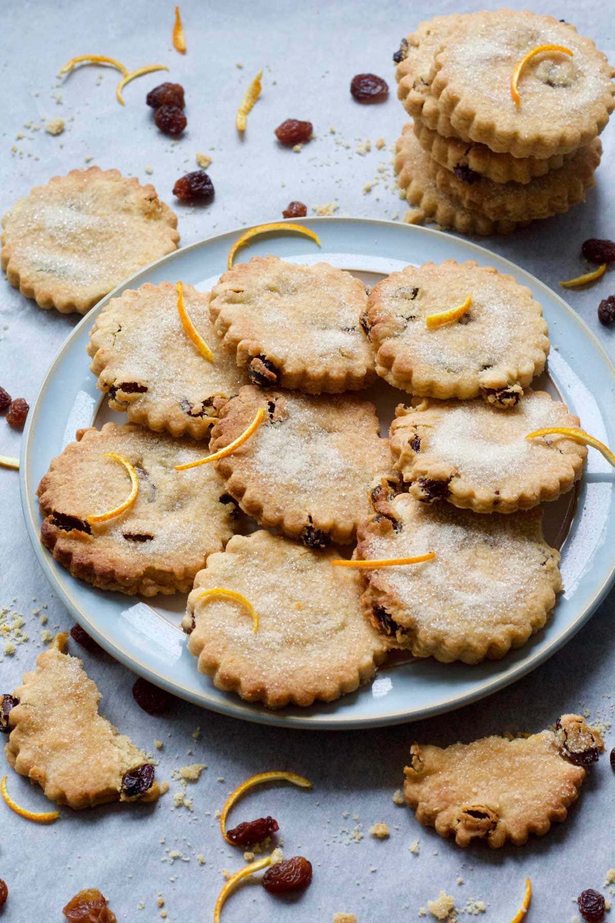 Easter Biscuits on a plate decorated with orange rind.