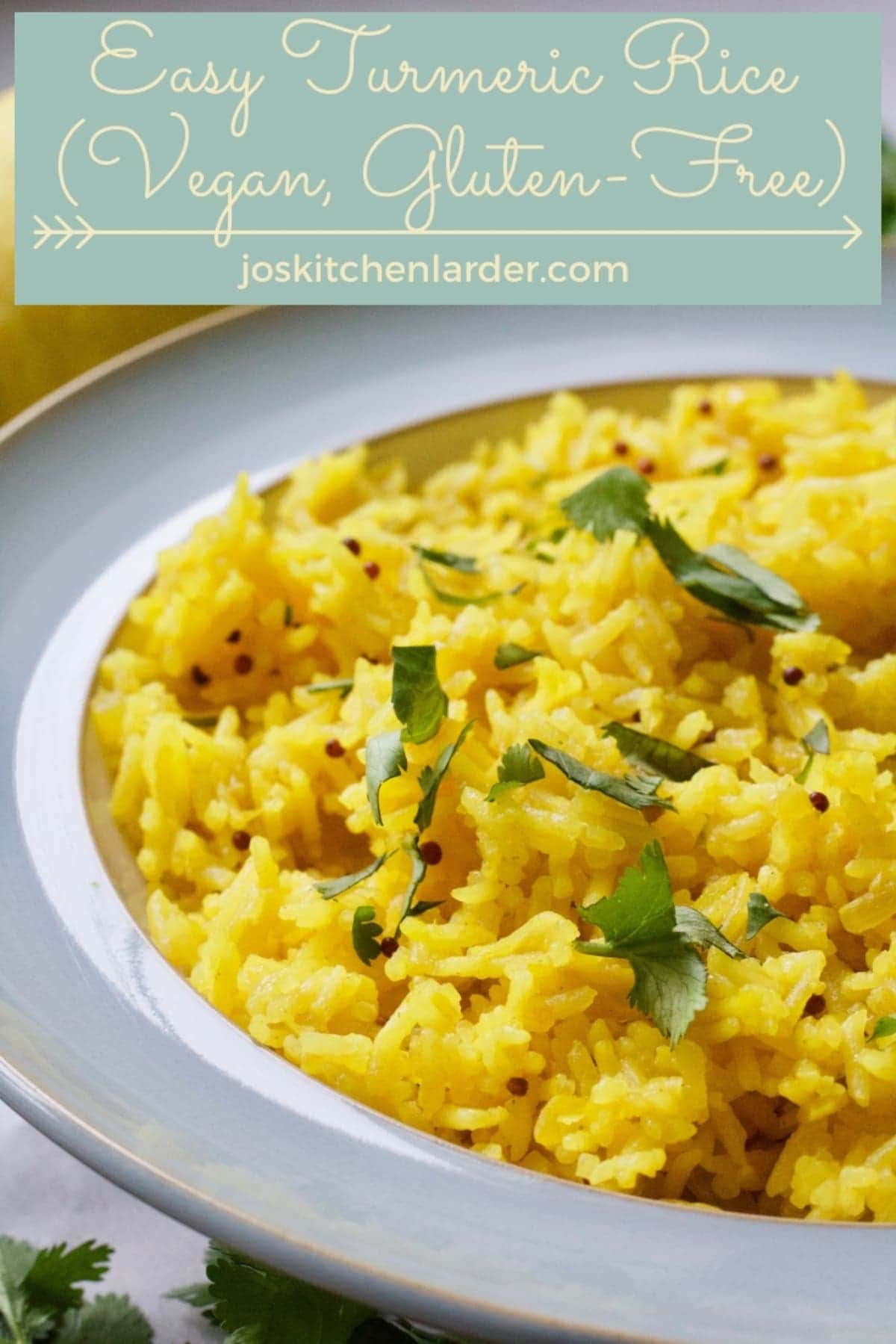 Turmeric rice close-up in a bowl with coriander garnish.