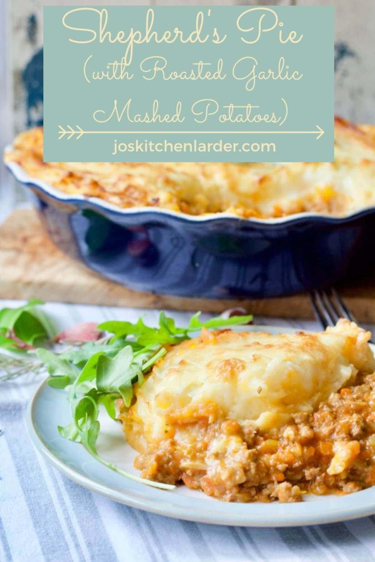 Portion of shepherd's pie on a plate with salad garnish.