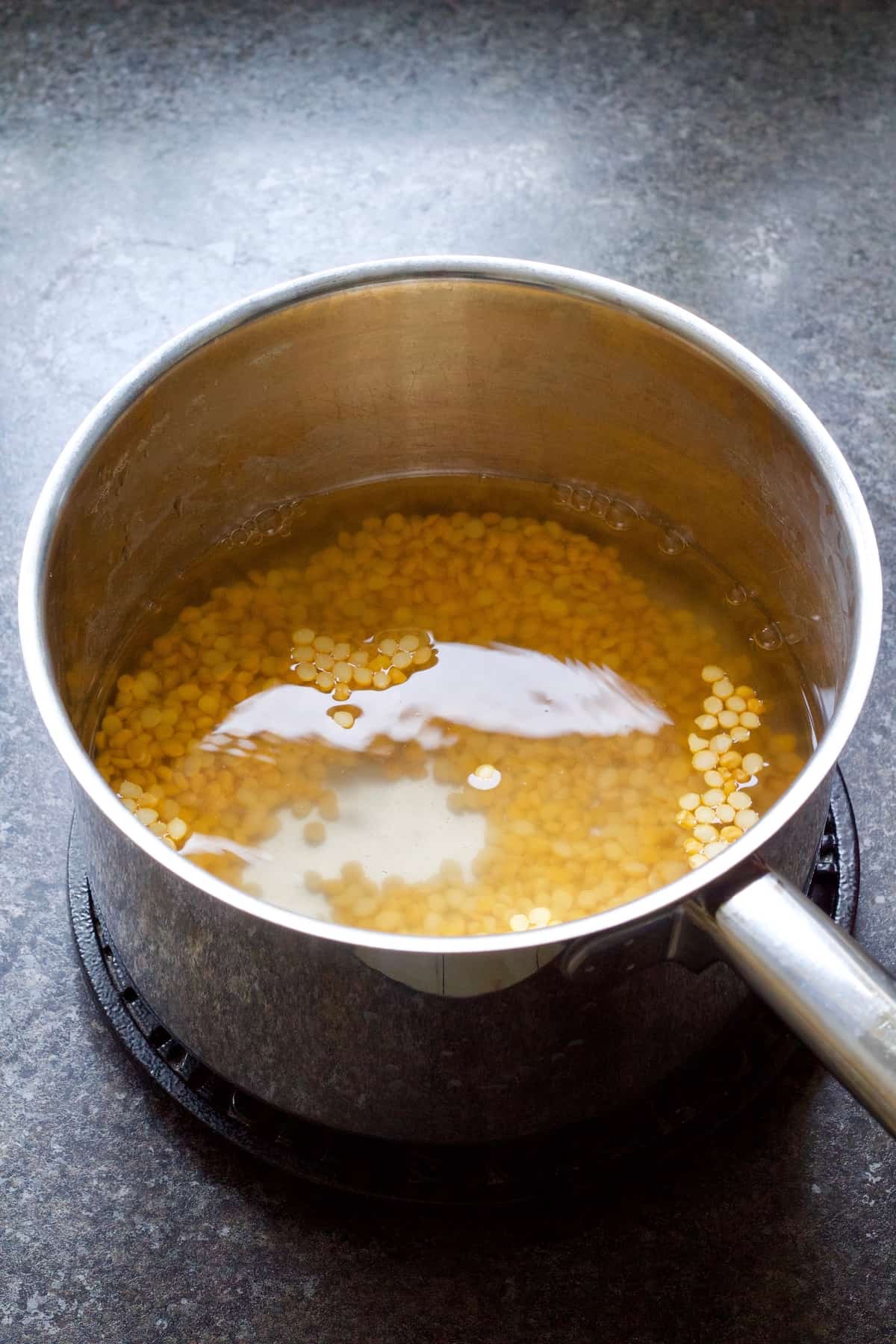 Chana dhal in a pan with water.