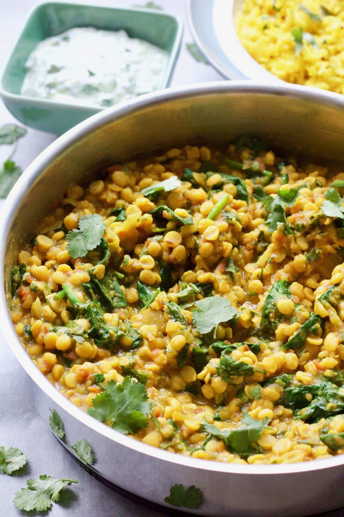 Tarka Dhal garnished with coriander in a pan.