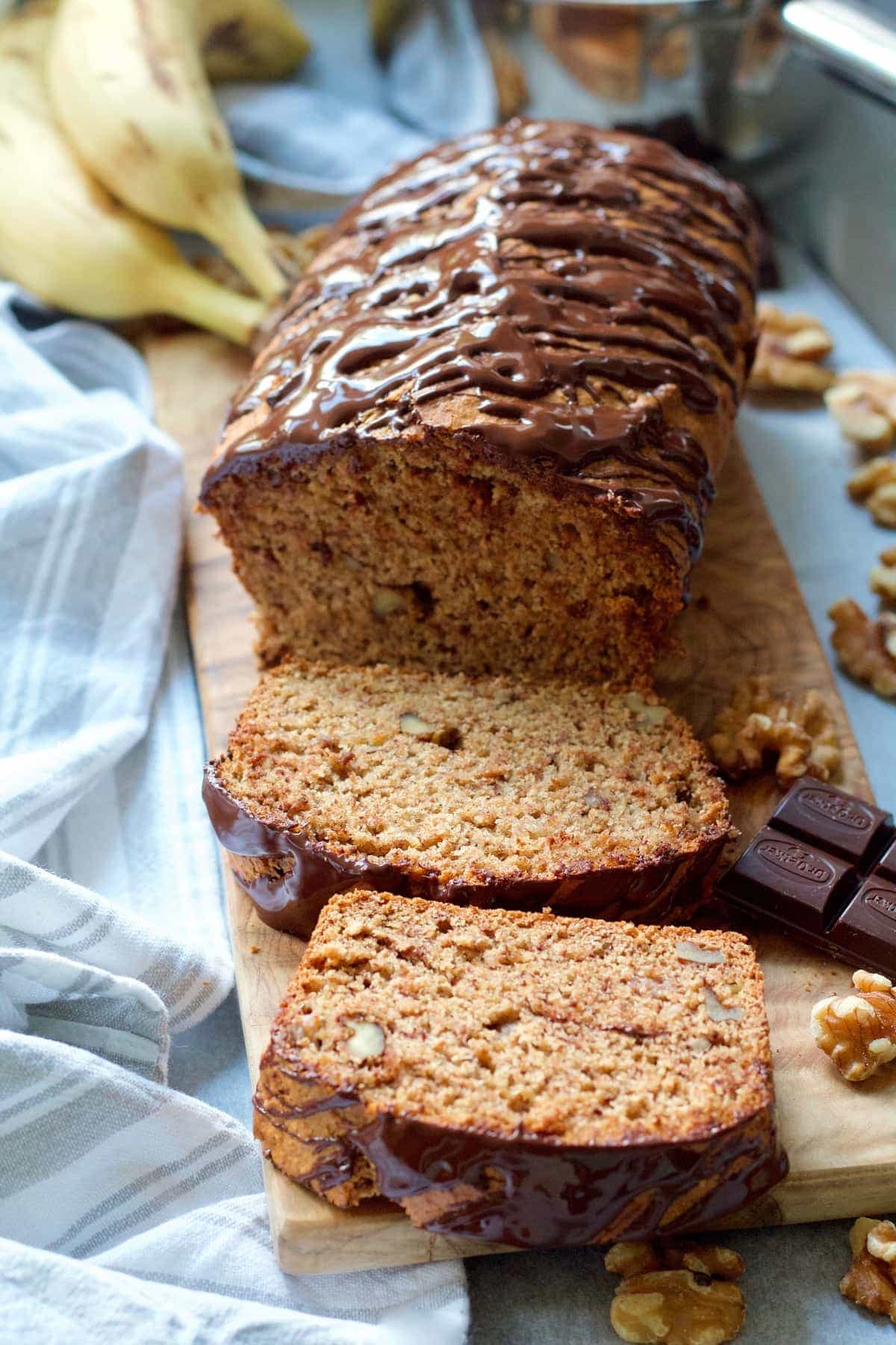 Banana bread with two slices cut off.