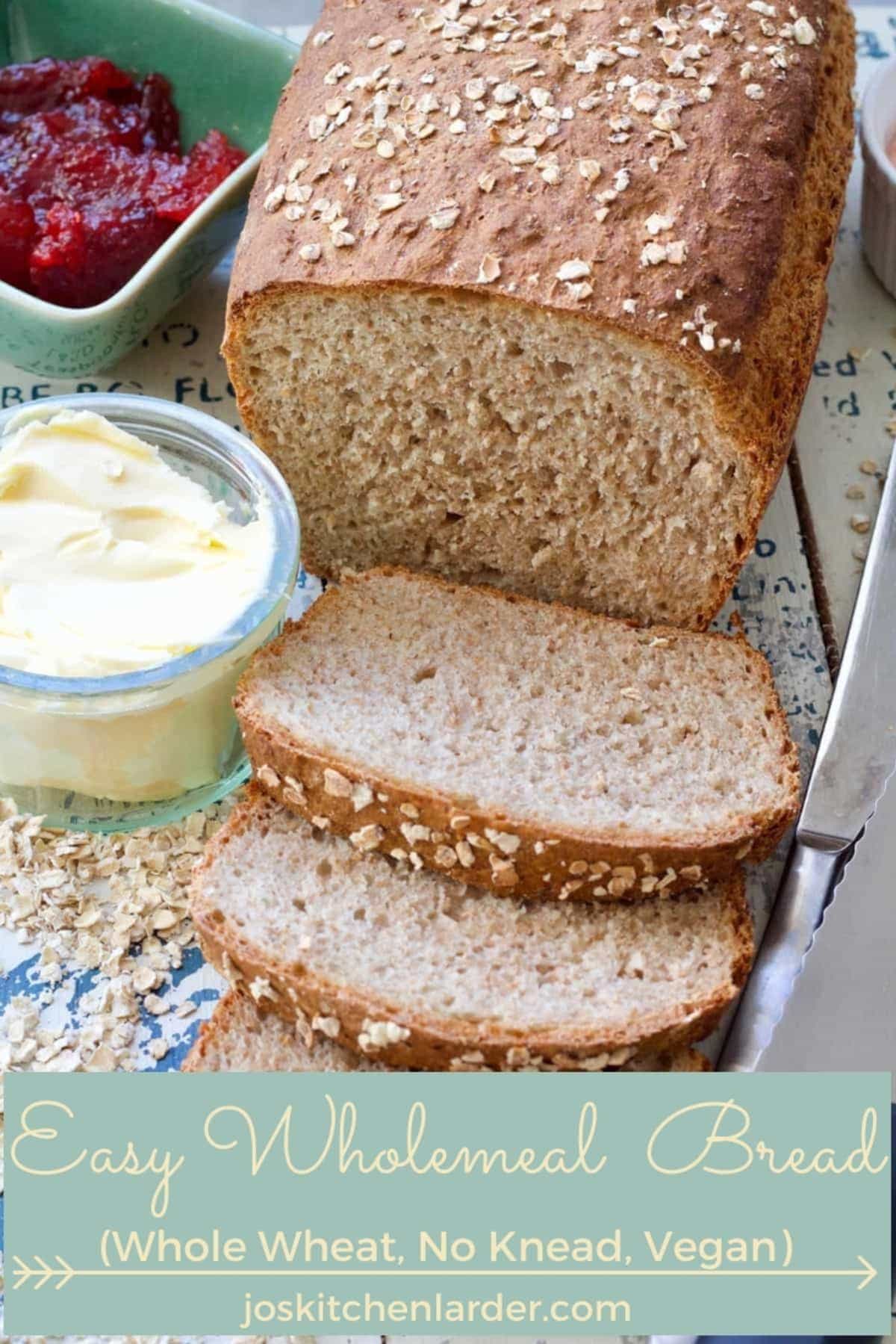 Wholemeal bread loaf and few slices.