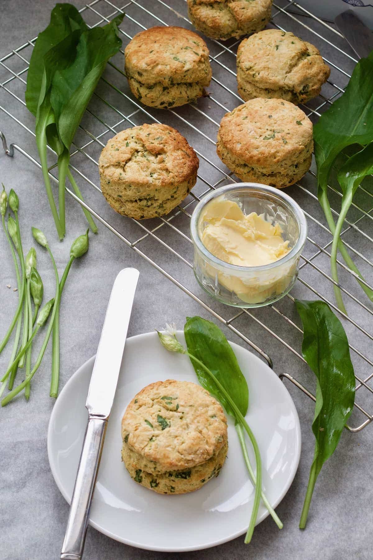 Vegan cheese scones, butter and wild garlic leaves.