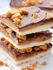 Close up of a stack of 3 Biscoff Millionaire's Shortbread pieces.