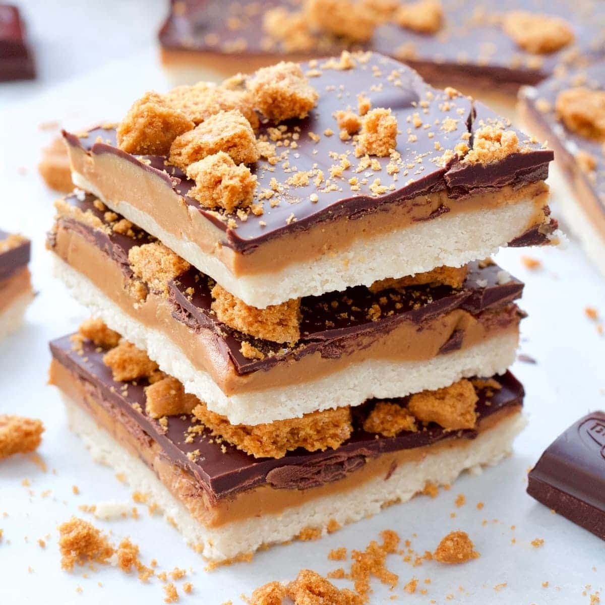 Close up of a stack of 3 Biscoff Millionaire's Shortbread pieces.
