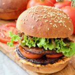 Portobello mushroom burger on a board.