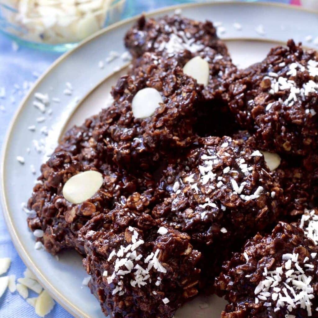 Chocolate Oatmeal cookies piled up on a plate.