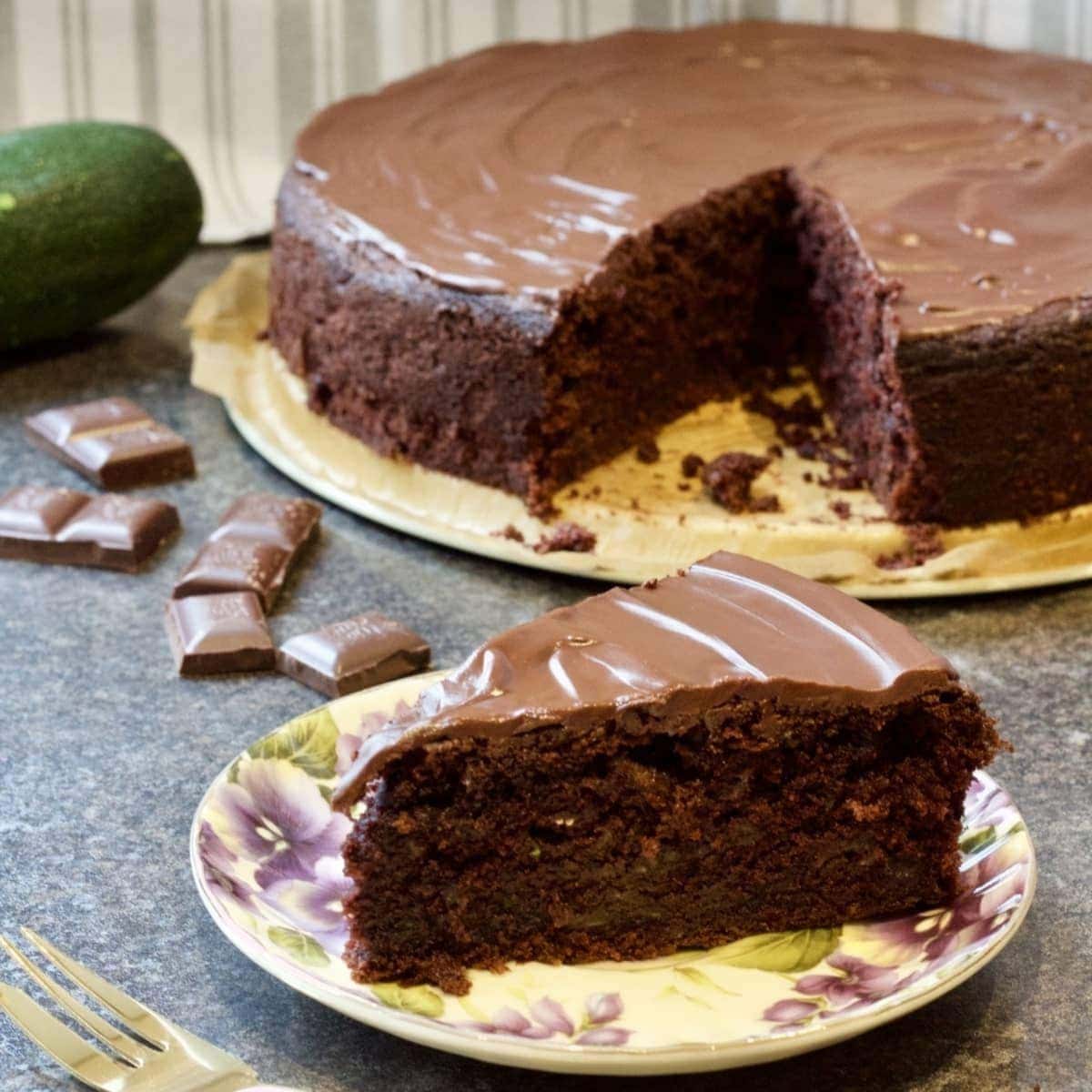 Chocolate Courgette Cake slice on a plate.