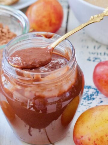 Jar with plum jam with chocolate.
