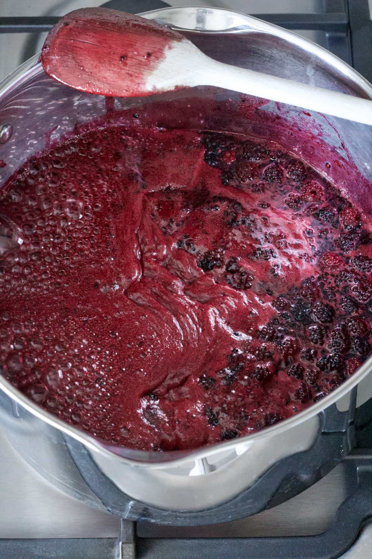 Large pan with boiling jam mixture.