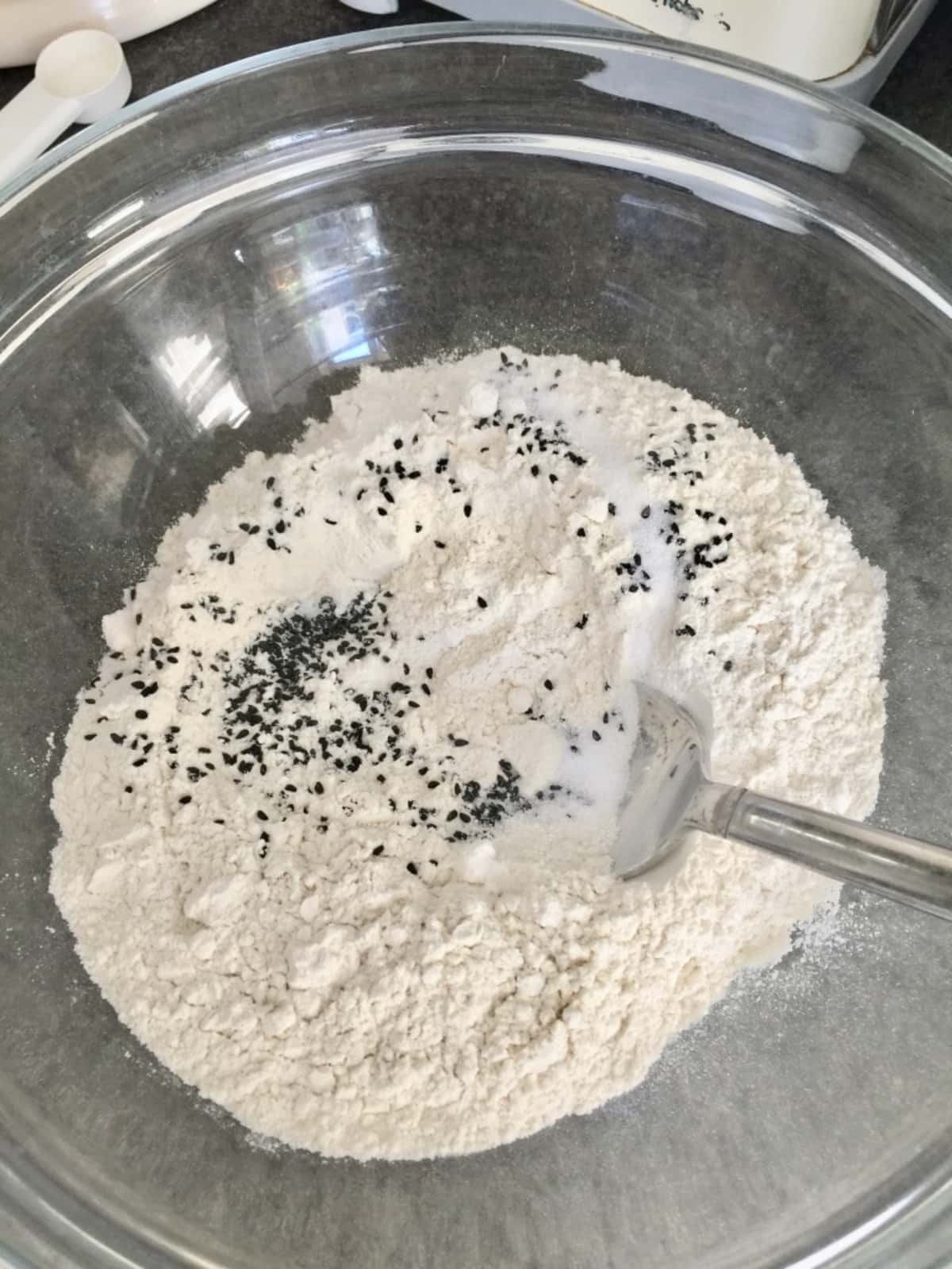 Flour, salt and nigella seeds in a bowl.