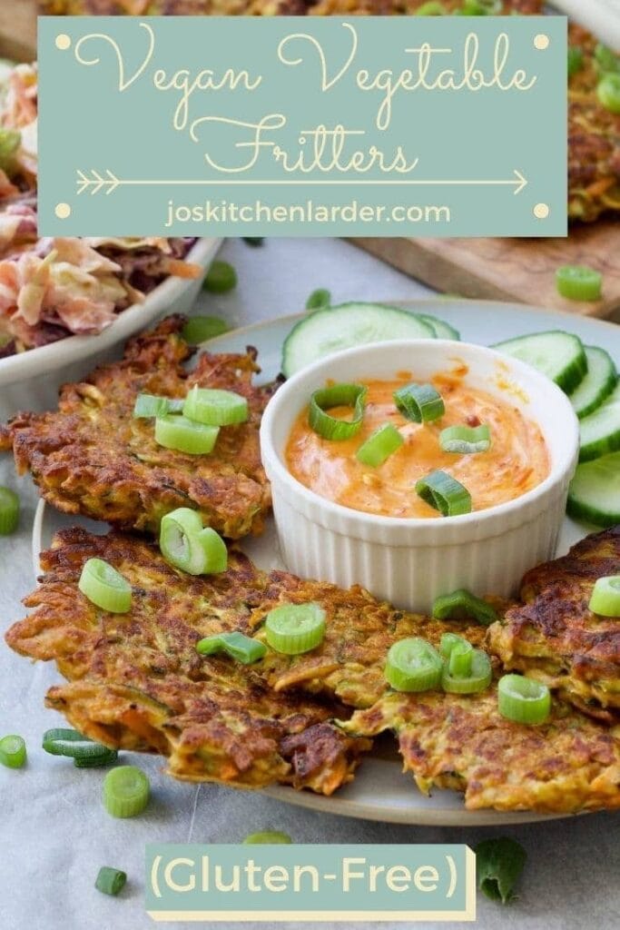 Fritters on a plate with cucumber & sauce for Pinterest.