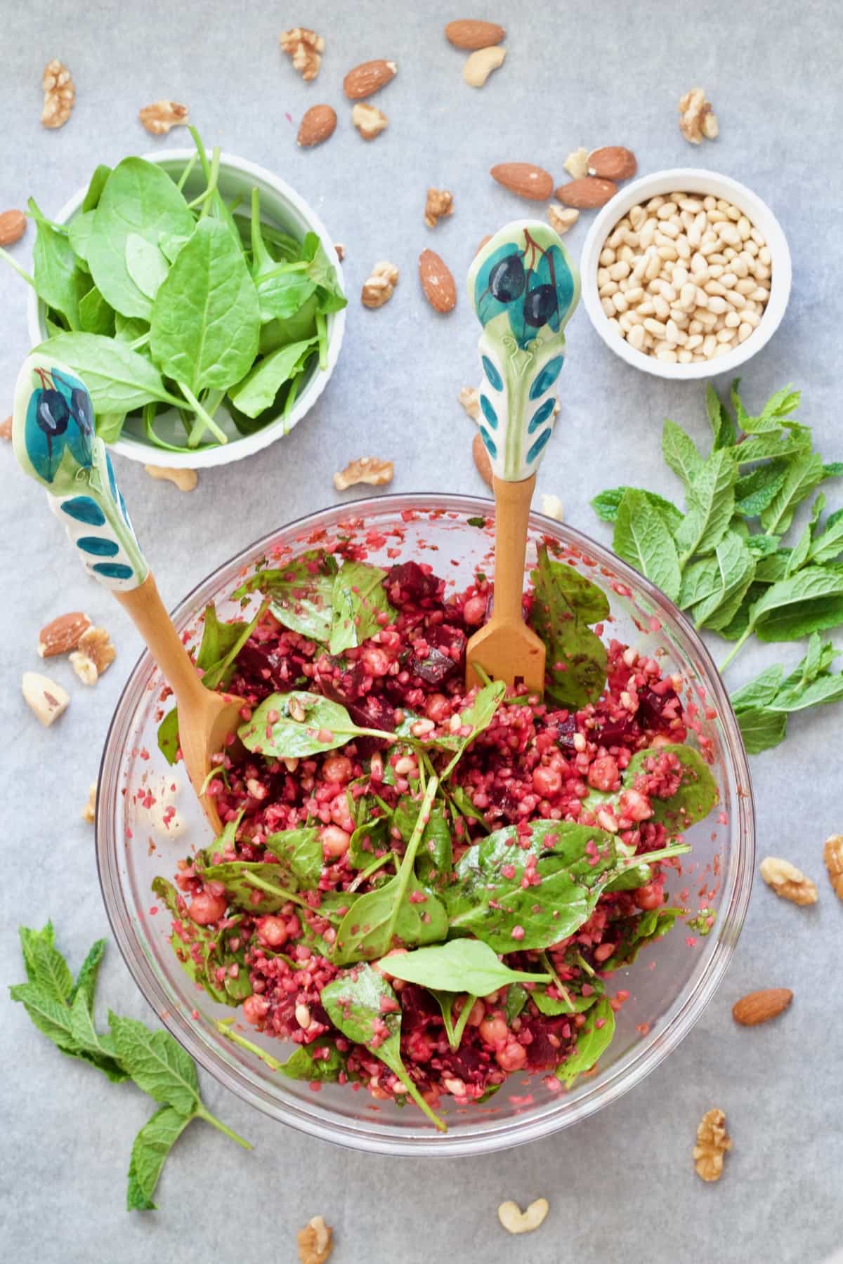 Buckwheat & beetroot salad with spinach and pine nuts in bowls.