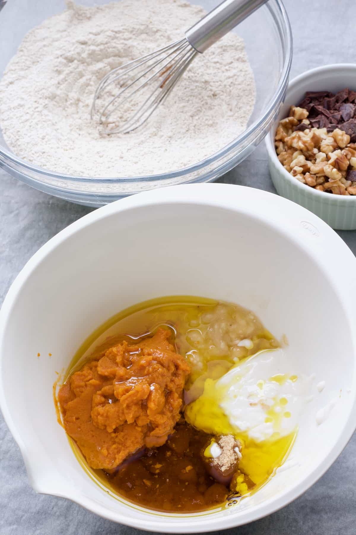 Wet and dry cake ingredients in separate bowls.