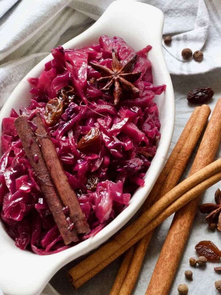 Oval dish with red braised cabbage, raisins and spices.