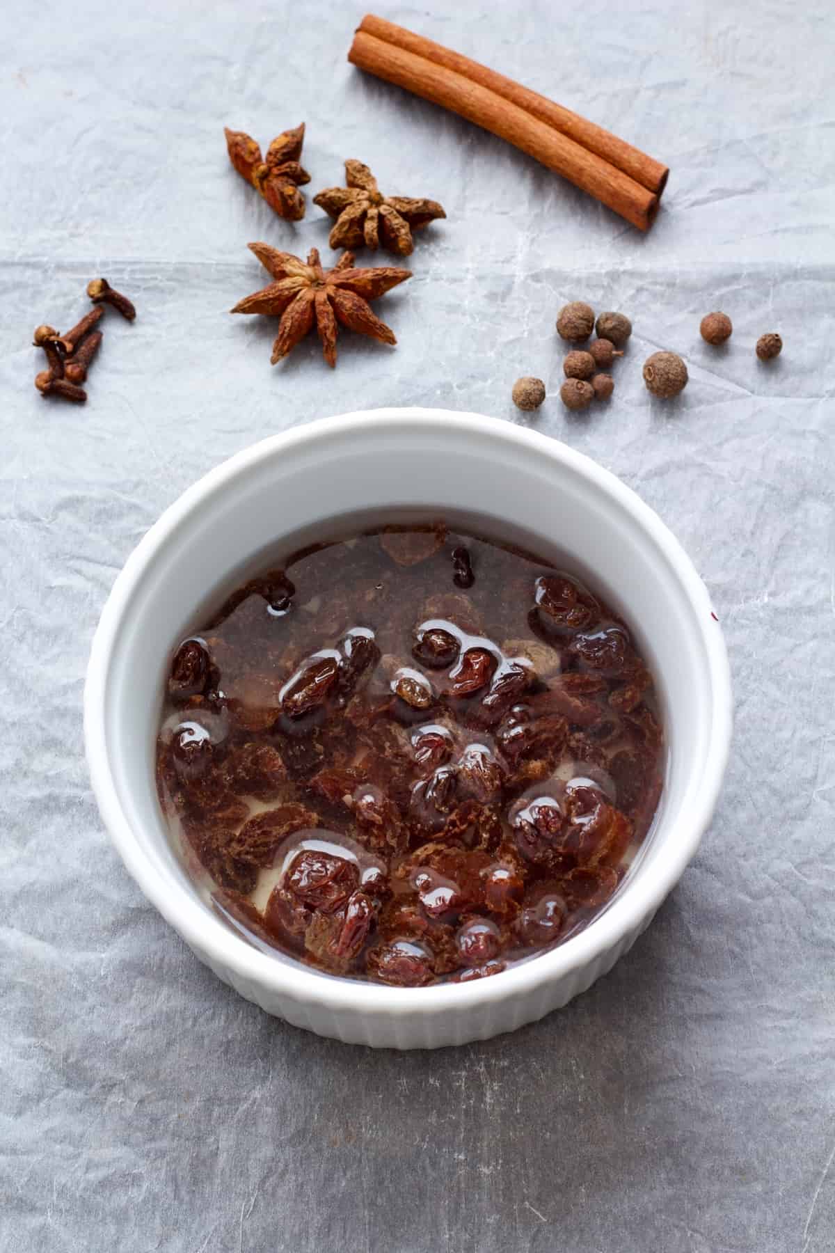 Bowl with raisins covered with water.