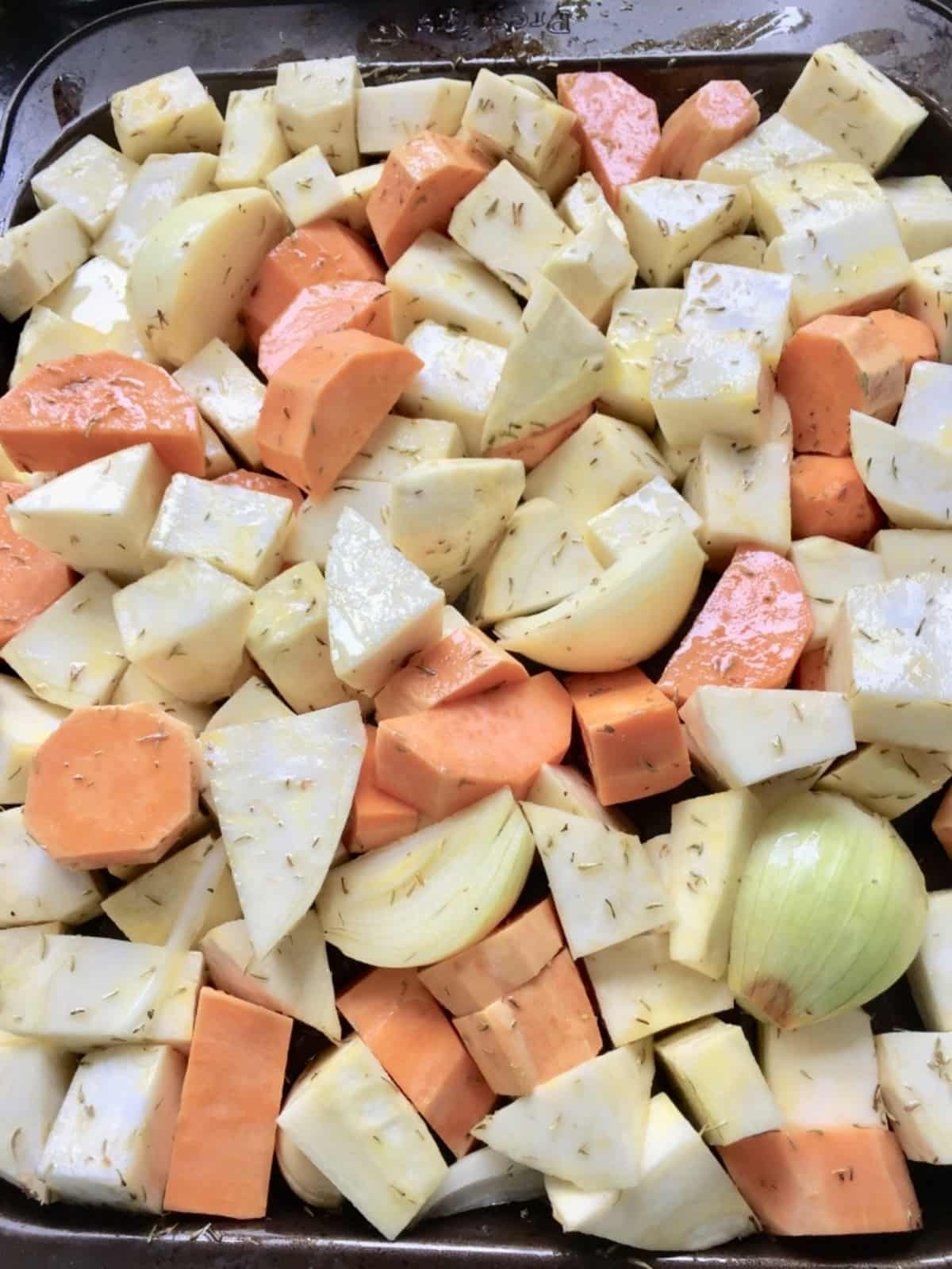 Vegetable chunks on a baking tray.