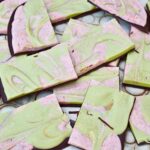 Chocolate bark pieces green and pink.