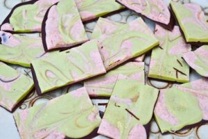 Chocolate bark pieces green and pink.