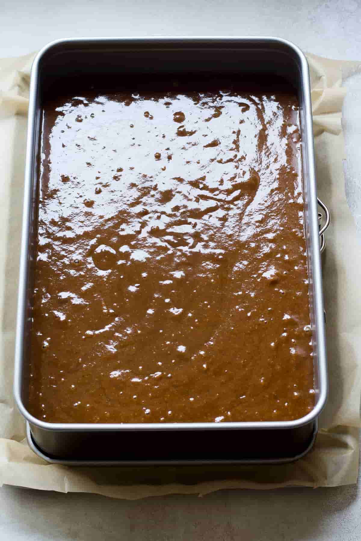 Cake batter in a tin ready for the oven.