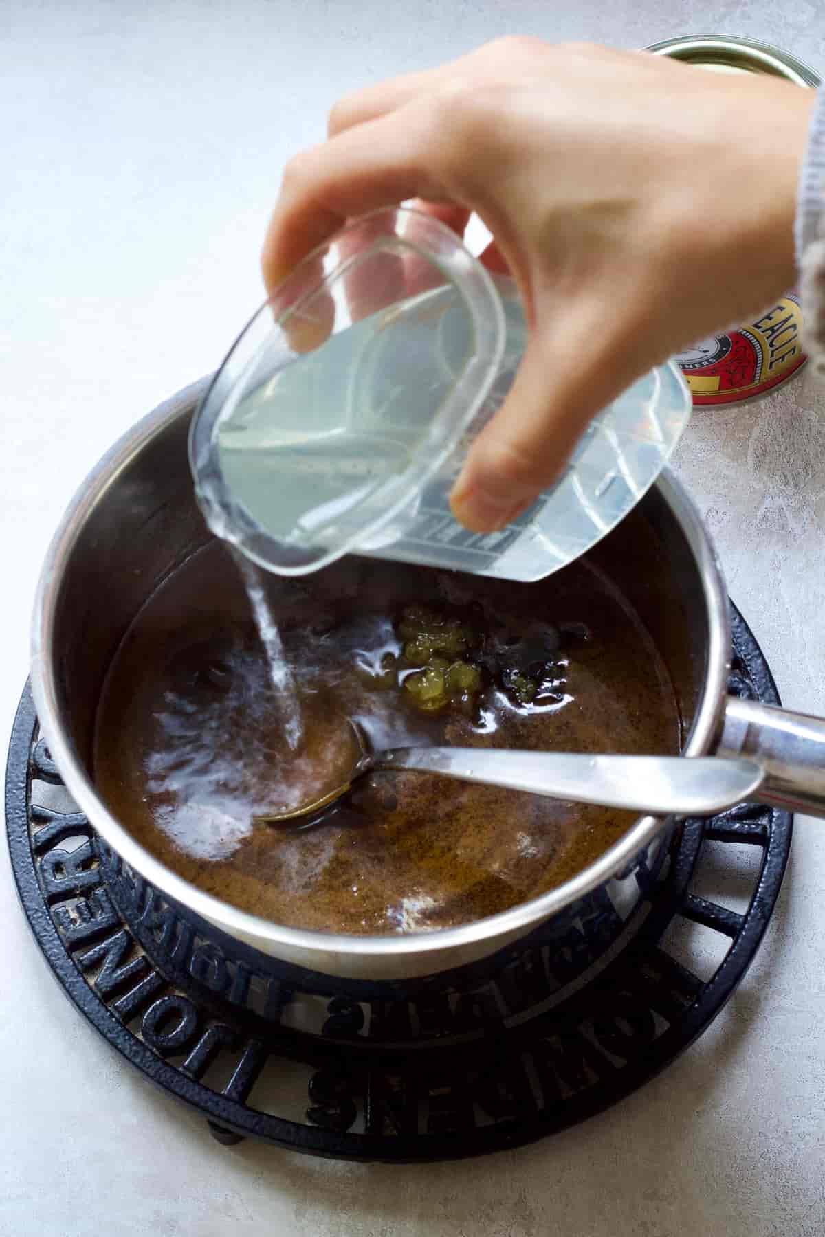 Hot water being added to the pan.