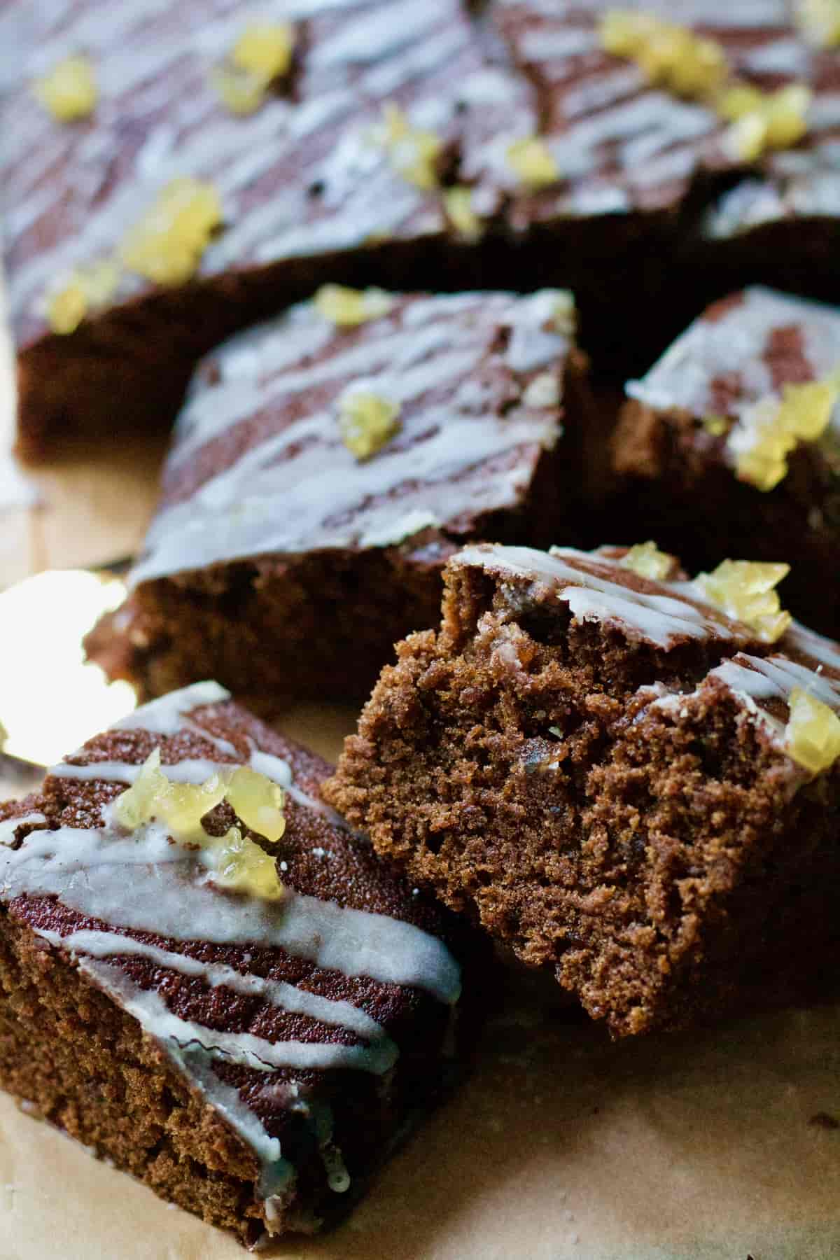 Gingerbread cake squares stack at an angle.