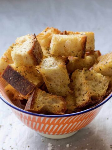 Small bowl full of croutons.