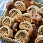 Fig rolls with dried figs in a basket.