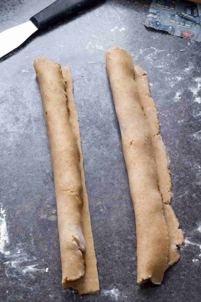 Fig filling being rolled in pastry.
