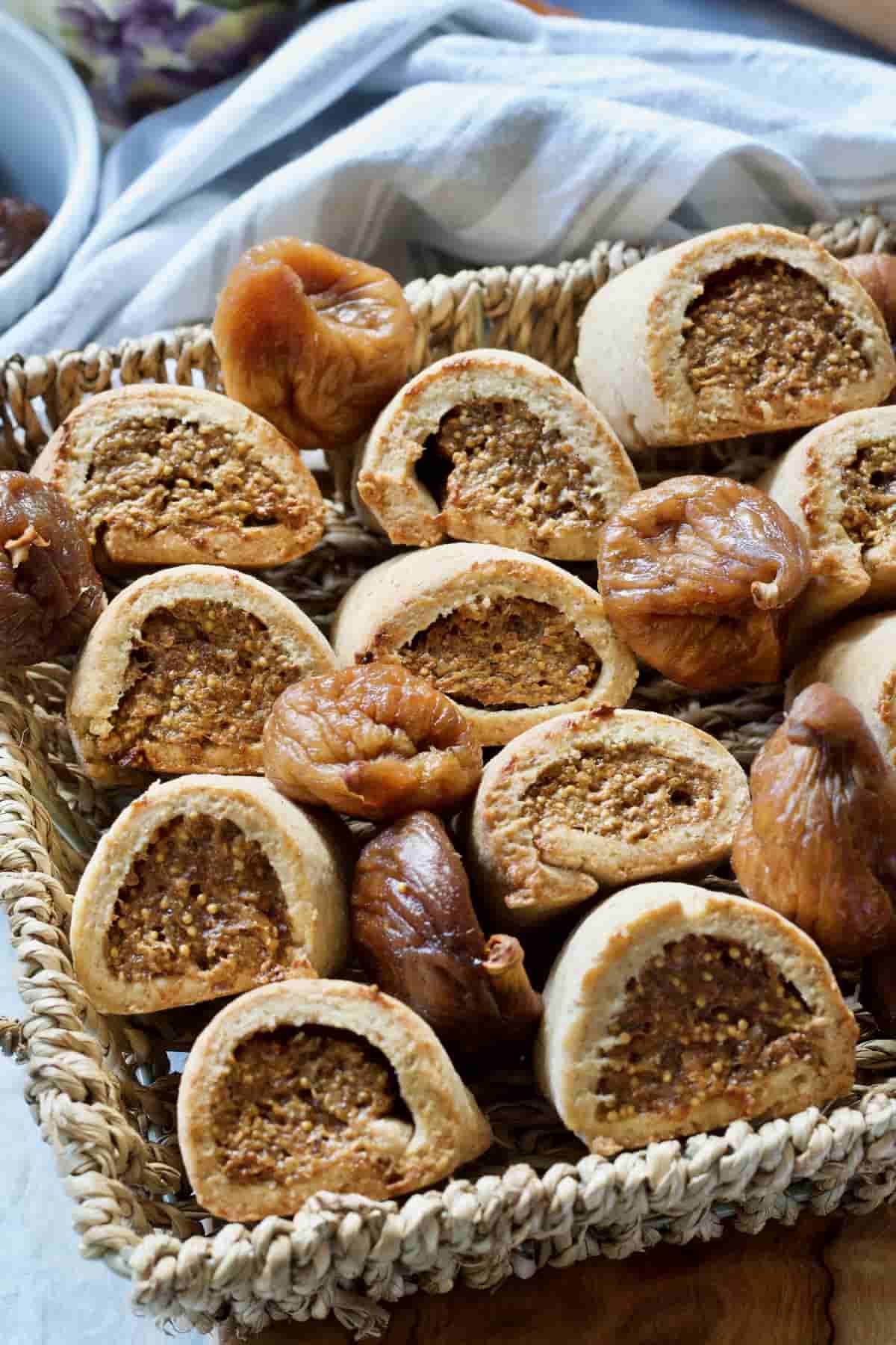 Wicker basket with homemade fig rolls and dried figs.