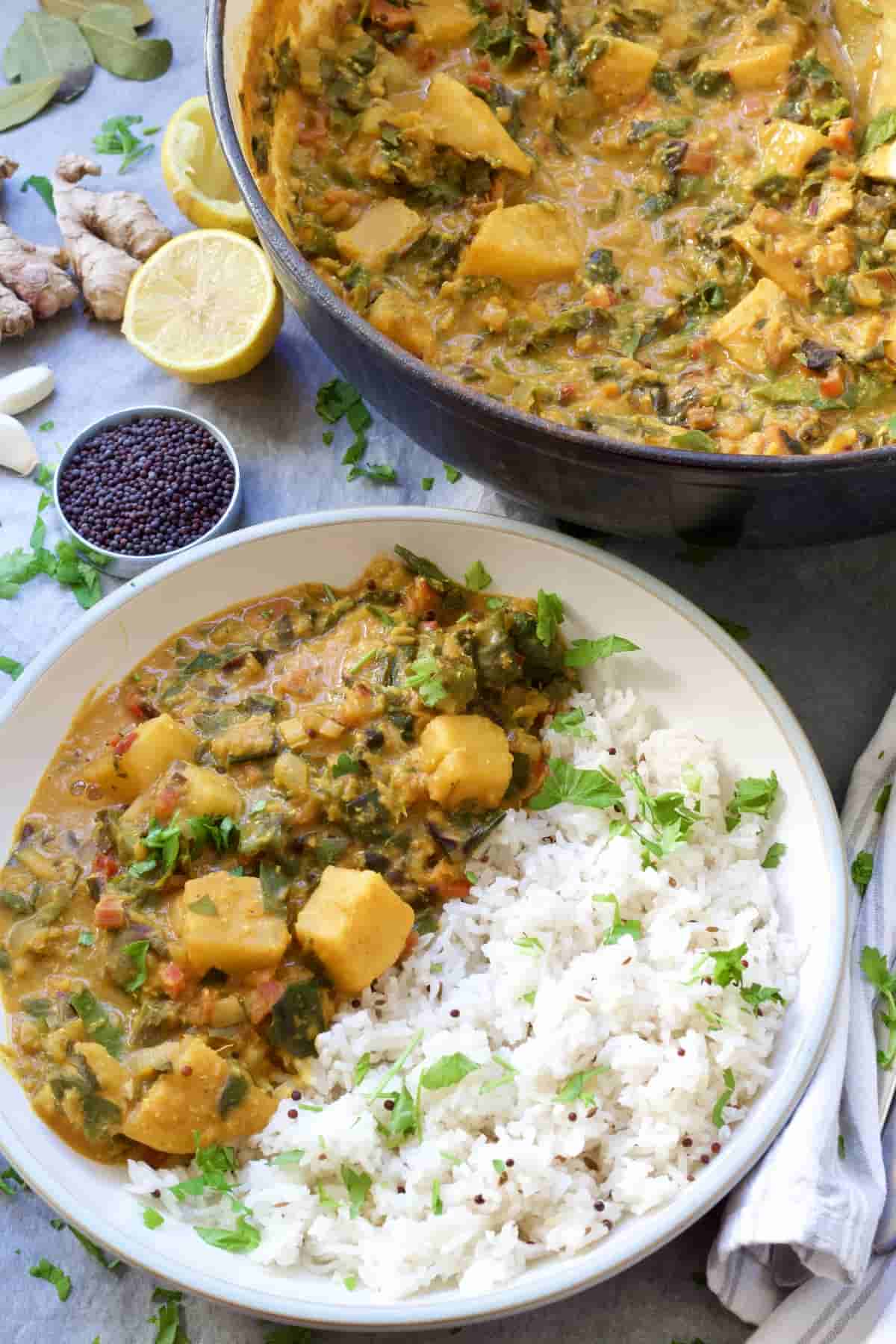 Plated up celeriac & chard vegetable curry with rice.