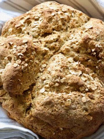 Close up of baked vegan soda bread loaf.