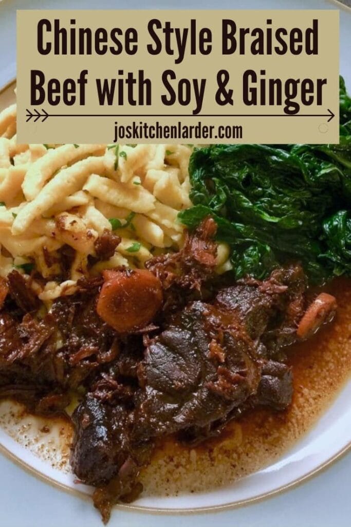 Chinese beef with soy and ginger, noodles and kale on a plate.