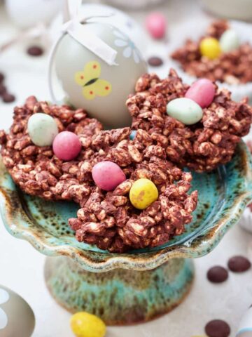 Easter Chocolate Nests on a mini cake stand with an Easter egg.