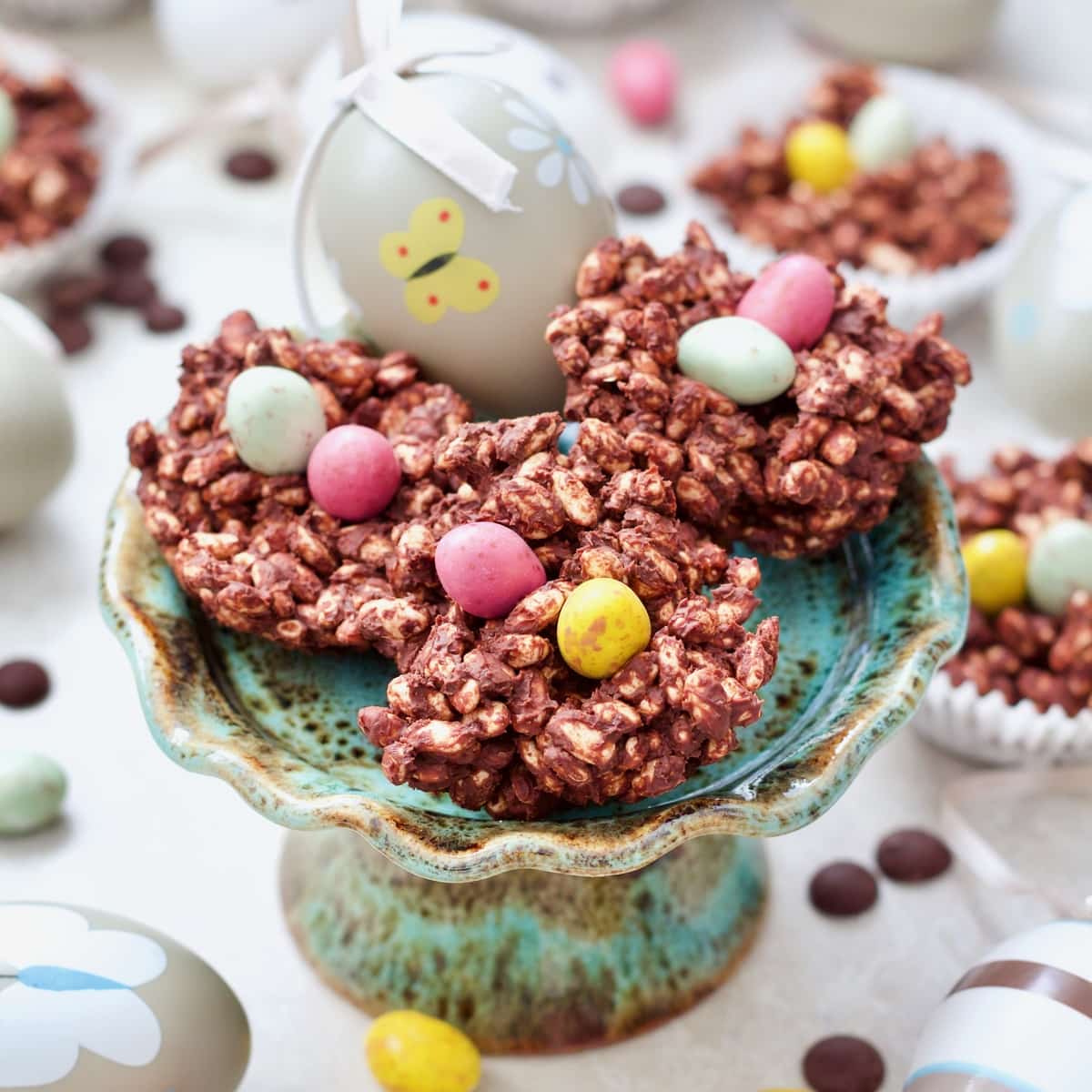 Easter Chocolate Nests on a mini cake stand with an Easter egg.