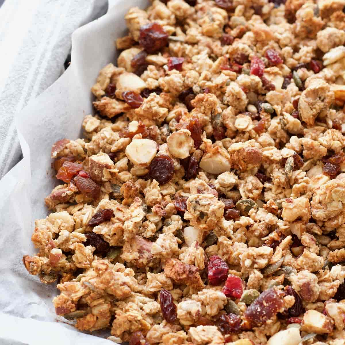 Baked homemade granola in a tray.
